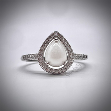 Load image into Gallery viewer, Breast Milk Keepsake Ring with 6x8mm Teardrop Breast Milk “Stone” in a Halo of Cubic Zirconia