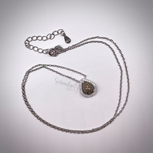Load image into Gallery viewer, 6x8mm Sterling Silver Tear Drop Cremation Ash Pendant with a Cubic Zirconia Halo