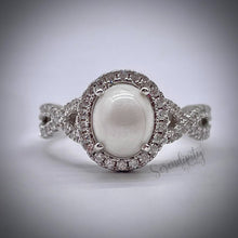 Load image into Gallery viewer, 7x9mm Breast Milk Keepsake Ring with Large Breast Milk “Stone” in a Halo and Infinity Band of Cubic Zirconia