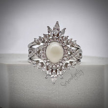 Load image into Gallery viewer, 7x9mm Breast Milk Keepsake Ring with Large Breast Milk “Stone” in a Halo and Infinity Band of Cubic Zirconia with Stacking Bands