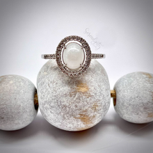 Load image into Gallery viewer, Breast Milk Keepsake Ring with 6x8mm Breast Milk “Stone” in a Halo of Cubic Zirconia