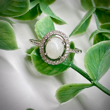 Load image into Gallery viewer, Breast Milk Keepsake Ring with 6x8mm Breast Milk “Stone” in a Halo of Cubic Zirconia