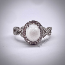 Load image into Gallery viewer, 7x9mm Breast Milk Keepsake Ring with Large Breast Milk “Stone” in a Halo and Infinity Band of Cubic Zirconia