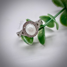 Load image into Gallery viewer, 7x9mm Breast Milk Keepsake Ring with Large Breast Milk “Stone” in a Halo and Infinity Band of Cubic Zirconia