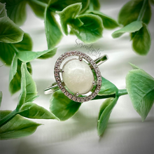 Load image into Gallery viewer, Breast Milk Keepsake Ring with 6x8mm Breast Milk “Stone” in a Halo of Cubic Zirconia