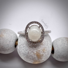 Load image into Gallery viewer, Breast Milk Keepsake Ring with 6x8mm Breast Milk “Stone” in a Halo of Cubic Zirconia