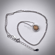 Load image into Gallery viewer, 6x8mm Sterling Silver Tear Drop Cremation Ash Pendant with a Cubic Zirconia Halo
