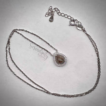 Load image into Gallery viewer, 6x8mm Sterling Silver Tear Drop Cremation Ash Pendant with a Cubic Zirconia Halo