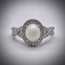 Load image into Gallery viewer, 7x9mm Breast Milk Keepsake Ring with Large Breast Milk “Stone” in a Halo and Infinity Band of Cubic Zirconia