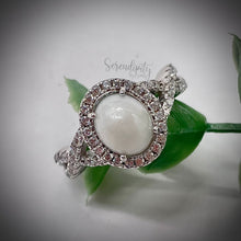 Load image into Gallery viewer, 7x9mm Breast Milk Keepsake Ring with Large Breast Milk “Stone” in a Halo and Infinity Band of Cubic Zirconia