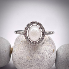 Load image into Gallery viewer, Breast Milk Keepsake Ring with 6x8mm Breast Milk “Stone” in a Halo of Cubic Zirconia