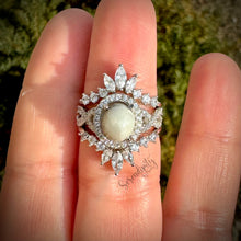 Load image into Gallery viewer, 7x9mm Breast Milk Keepsake Ring with Large Breast Milk “Stone” in a Halo and Infinity Band of Cubic Zirconia with Stacking Bands