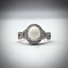 Load image into Gallery viewer, 7x9mm Breast Milk Keepsake Ring with Large Breast Milk “Stone” in a Halo and Infinity Band of Cubic Zirconia