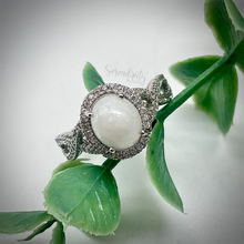 Load image into Gallery viewer, 7x9mm Breast Milk Keepsake Ring with Large Breast Milk “Stone” in a Halo and Infinity Band of Cubic Zirconia