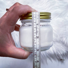 Load image into Gallery viewer, 6oz natural soy wax candle with a double wood wick. I created a special blend of essential oils that are associated with each particular zodiac sign. Each are also infused with floral elements, herbs, and genuine crystal gemstones, each candle containing those specific to their sign.