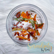 Load image into Gallery viewer, 6oz natural soy wax candle with a double wood wick. I created a special blend of essential oils that are associated with each particular zodiac sign. Each are also infused with floral elements, herbs, and genuine crystal gemstones, each candle containing those specific to their sign.