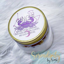 Load image into Gallery viewer, 6oz natural soy wax candle with a double wood wick. I created a special blend of essential oils that are associated with each particular zodiac sign. Each are also infused with floral elements, herbs, and genuine crystal gemstones, each candle containing those specific to their sign.