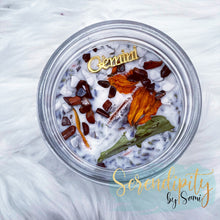 Load image into Gallery viewer, 6oz natural soy wax candle with a double wood wick. I created a special blend of essential oils that are associated with each particular zodiac sign. Each are also infused with floral elements, herbs, and genuine crystal gemstones, each candle containing those specific to their sign.