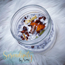 Load image into Gallery viewer, 6oz natural soy wax candle with a double wood wick. I created a special blend of essential oils that are associated with each particular zodiac sign. Each are also infused with floral elements, herbs, and genuine crystal gemstones, each candle containing those specific to their sign.