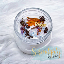 Load image into Gallery viewer, 6oz natural soy wax candle with a double wood wick. I created a special blend of essential oils that are associated with each particular zodiac sign. Each are also infused with floral elements, herbs, and genuine crystal gemstones, each candle containing those specific to their sign.