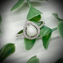 Load image into Gallery viewer, Breast Milk Keepsake Ring with 6x8mm Teardrop Breast Milk “Stone” in a Halo of Cubic Zirconia
