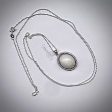 Load image into Gallery viewer, Sterling Silver Oval Breast Milk Pendant with a Cubic Zirconia Halo
